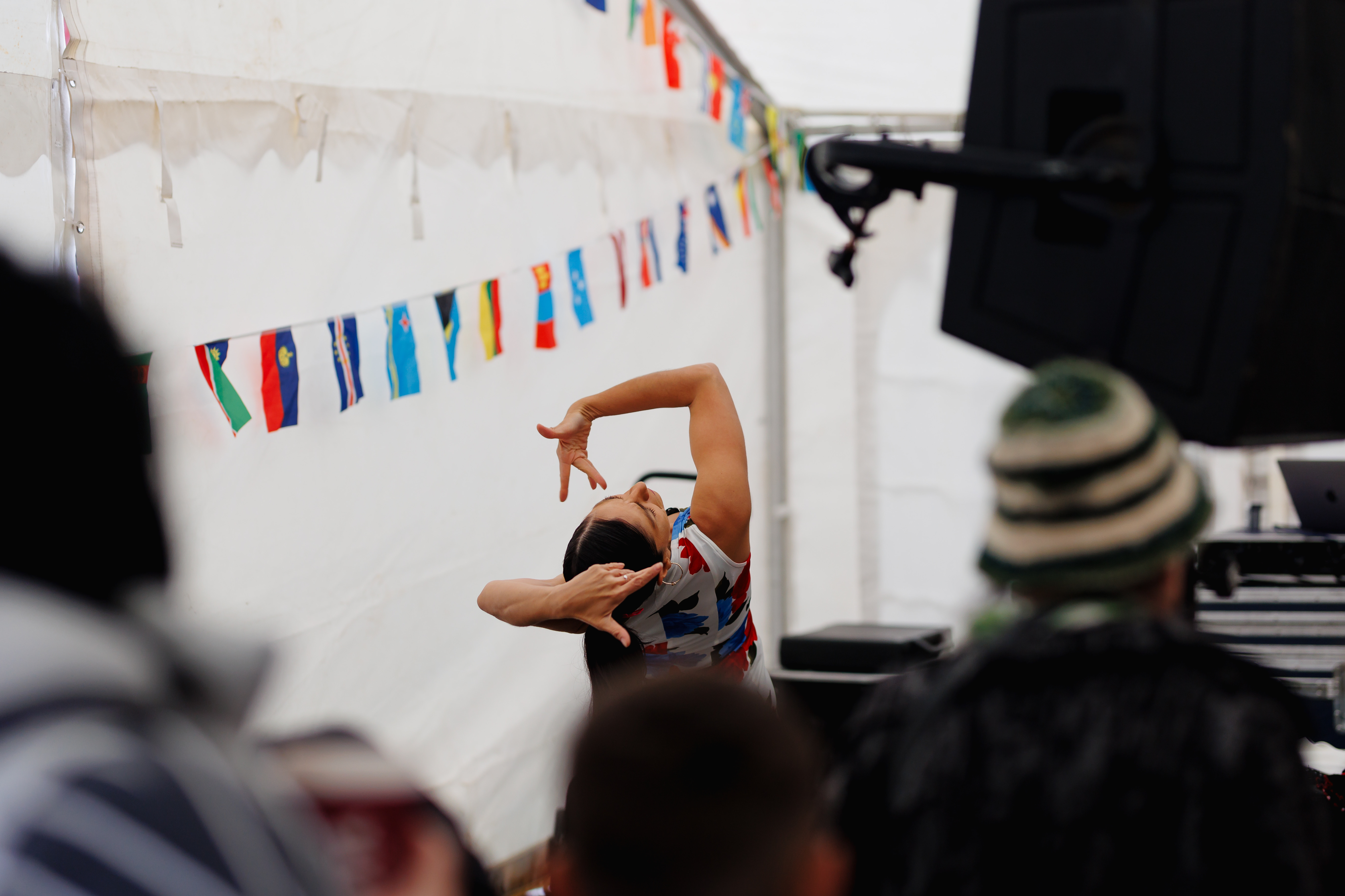 Festival goers watching a performance by a flamenco dancer in the global village