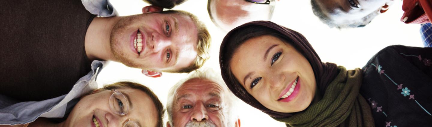 A group of people staring down at a camera