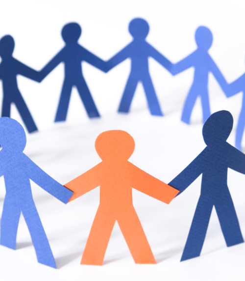 A circle of paper people.